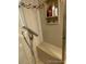 Modern shower featuring tile surround, shower bench and toiletries shelf at 9060 E Cherry Creek South Dr # E, Denver, CO 80231