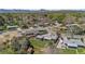 Residential area showcases neatly arranged houses with green lawns and tree-lined streets at 1568 S Dudley Ct, Lakewood, CO 80232