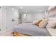 Basement bedroom with neutral decor, closet space, and plush pillows at 1568 S Dudley Ct, Lakewood, CO 80232