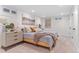 Basement bedroom with dresser, plush pillows, and closet space at 1568 S Dudley Ct, Lakewood, CO 80232