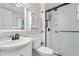 Clean bathroom features a classic vanity and a glass shower stall with bronze fixtures at 16308 E Wyoming Dr, Aurora, CO 80017