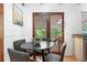 Charming breakfast nook with wood floors and table set for four, adjacent to a bright granite counter at 16308 E Wyoming Dr, Aurora, CO 80017
