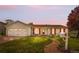 Charming home with red shutters, manicured lawn, and a welcoming stone walkway at 16308 E Wyoming Dr, Aurora, CO 80017