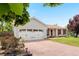 Home featuring an attached two-car garage and a wide driveway at 16308 E Wyoming Dr, Aurora, CO 80017