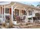 Charming front porch with welcoming seating and decorative touches, perfect for enjoying the outdoors at 16308 E Wyoming Dr, Aurora, CO 80017