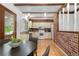 Eat-in kitchen area with warm wooden accents, including exposed beams and hardwood floors at 16308 E Wyoming Dr, Aurora, CO 80017
