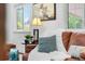 Cozy living room with comfortable seating, layered textures, and natural light from windows overlooking the front yard at 16308 E Wyoming Dr, Aurora, CO 80017