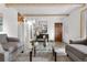 Comfortable living room featuring hardwood floors and a large entryway at 16308 E Wyoming Dr, Aurora, CO 80017