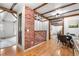 Open concept living space with wooden beams, hardwood floors, and stylish decor at 16308 E Wyoming Dr, Aurora, CO 80017