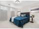 Serene main bedroom featuring soft textures, decorative lighting, and calming colors at 16308 E Wyoming Dr, Aurora, CO 80017