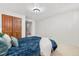 Comfortable main bedroom features plush bedding and a neutral color palette at 16308 E Wyoming Dr, Aurora, CO 80017