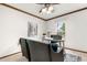 Comfortable office with natural light, exposed wood beams, and desk, ideal for working from home at 16308 E Wyoming Dr, Aurora, CO 80017