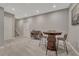 Finished basement area features a chess table, seating, and decor at 11796 Edenfeld St, Parker, CO 80134