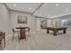 Finished basement with a pool table, game area, and comfortable seating at 11796 Edenfeld St, Parker, CO 80134