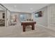 Finished basement game room features a large pool table and entertainment area at 11796 Edenfeld St, Parker, CO 80134