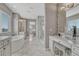 The luxurious bathroom features a soaking tub, dual vanities, and makeup area at 11796 Edenfeld St, Parker, CO 80134