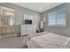Bedroom with light walls, and a connecting bathroom at 11796 Edenfeld St, Parker, CO 80134