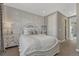 Comfortable bedroom with a large window, soft lighting, and a decorative bedside table at 11796 Edenfeld St, Parker, CO 80134