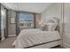 Cozy bedroom with a large window, soft lighting, and comfortable bedding at 11796 Edenfeld St, Parker, CO 80134