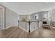 Second story hall featuring white railing, wood floors, and large window at 11796 Edenfeld St, Parker, CO 80134