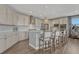 Modern kitchen with granite countertops, stainless steel appliances, and a spacious island with bar seating at 11796 Edenfeld St, Parker, CO 80134