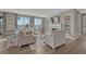 Cozy living room with a fireplace, large windows with a view, and comfortable seating, perfect for relaxation at 11796 Edenfeld St, Parker, CO 80134