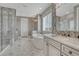 Luxurious main bathroom with a soaking tub, walk-in shower, and double vanity sinks at 11796 Edenfeld St, Parker, CO 80134