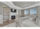 Stunning main bedroom boasts a fireplace, tv, and access to the bathroom at 11796 Edenfeld St, Parker, CO 80134