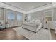 Spacious main bedroom with tray ceilings, natural light, hardwood floors and neutral decor at 11796 Edenfeld St, Parker, CO 80134