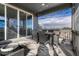 Inviting covered patio with dining and lounging areas offering scenic outdoor views and lighting at 11796 Edenfeld St, Parker, CO 80134