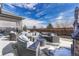 Inviting patio area with comfortable seating, outdoor cooking space, and a charming outdoor ambiance at 11796 Edenfeld St, Parker, CO 80134