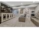 Home theater features a large screen TV, comfortable seating, and movie-themed decor at 11796 Edenfeld St, Parker, CO 80134