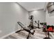 Well-equipped workout room featuring modern exercise equipment on stylish, gray wood-look floors at 11796 Edenfeld St, Parker, CO 80134