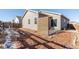 Private backyard with wood fence and patio at 488 Vista Blvd, Brighton, CO 80603