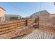 Backyard with wooden fence and string lights at 488 Vista Blvd, Brighton, CO 80603