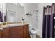 Clean bathroom with shower/tub combo and wood vanity at 488 Vista Blvd, Brighton, CO 80603
