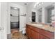 Main bathroom with walk-in closet and double vanity at 488 Vista Blvd, Brighton, CO 80603
