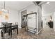 Dining area with tile floors and a modern chandelier at 488 Vista Blvd, Brighton, CO 80603