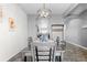 Dining area with a chandelier and view into the kitchen at 488 Vista Blvd, Brighton, CO 80603