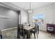 Dining room features a table and chairs, and a view of the backyard at 488 Vista Blvd, Brighton, CO 80603