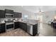 Modern kitchen with dark cabinets and stainless steel appliances at 488 Vista Blvd, Brighton, CO 80603