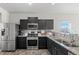 Kitchen features stainless steel appliances and granite countertops at 488 Vista Blvd, Brighton, CO 80603