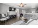 Bright living room featuring hardwood floors and a ceiling fan at 488 Vista Blvd, Brighton, CO 80603