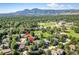 Aerial view showing home's location in a desirable neighborhood near mountains at 2512 Premier Pl, Boulder, CO 80304