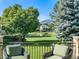 Deck overlooks pond, mountains, and lush green space at 2512 Premier Pl, Boulder, CO 80304