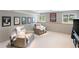 Finished basement recreation room with comfortable seating and artwork at 2512 Premier Pl, Boulder, CO 80304