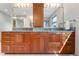 Bathroom boasts dual vanity, wood cabinets, and green marble countertops at 2512 Premier Pl, Boulder, CO 80304