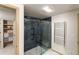 Modern bathroom with a glass shower, tiled walls, and heated towel rack at 2512 Premier Pl, Boulder, CO 80304