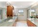 Spa-like bathroom with dual vanity and large mirror at 2512 Premier Pl, Boulder, CO 80304