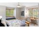 Spacious bedroom with window seat, desk, and ceiling fan at 2512 Premier Pl, Boulder, CO 80304